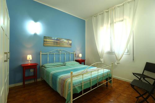 A bed or beds in a room at A Casa di Teresa