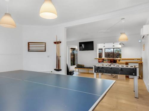 a ping pong table in a living room at Holiday Home Thorward - 1-5km from the sea by Interhome in Idestrup