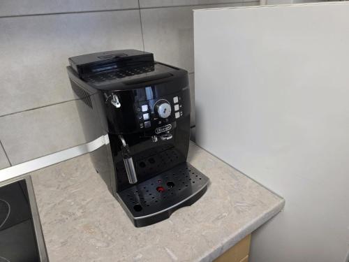 a coffee maker sitting on top of a counter at Milan Luxury Apartaments XVIII in Târgu-Mureş