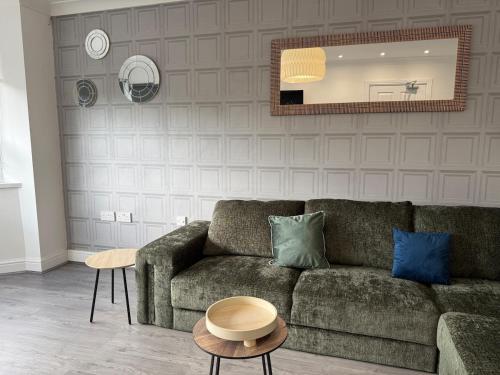 a living room with a couch and a mirror at ResiLets - Berwick House - Large 4 Bed Townhouse - Contractor stays in Cowpen