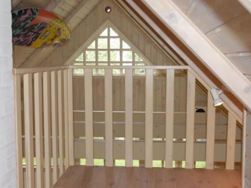 a garage with a vaulted ceiling and a window at Holiday Home Kalv - 75m from the sea by Interhome in Østerby
