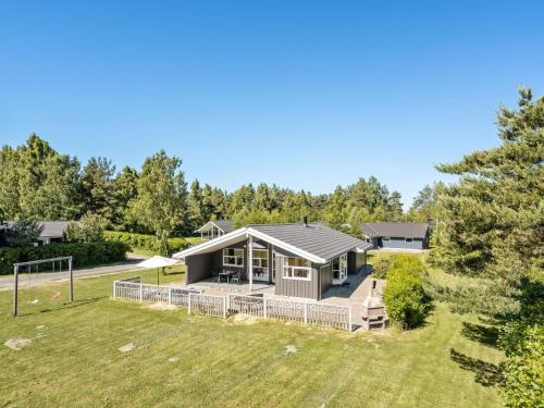 a home with a large yard with a house at Holiday Home Gith - 800m from the sea by Interhome in Marielyst
