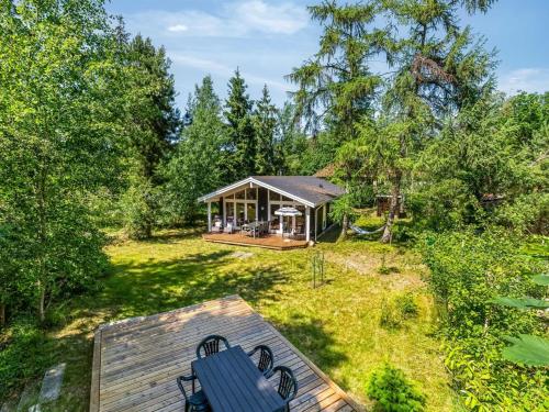 an overhead view of a tiny house in the woods at Holiday Home Hertta - 200m from the sea by Interhome in Marielyst