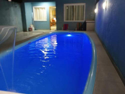 Πισίνα στο ή κοντά στο casa de praia em Matinhos