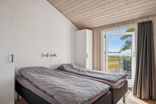 Giường trong phòng chung tại Amazing Home In Ebeltoft With 2 Bedrooms And Internet