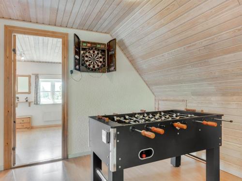 a large stove in a room with a ceiling at Holiday Home Ilja - 400m from the sea by Interhome in Sønderby