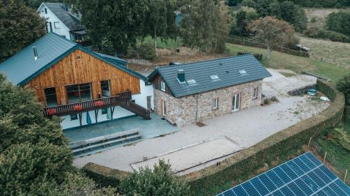an aerial view of a house with a solarium at Le vieux Sanglier - 41 pers - Malmedy in Malmedy