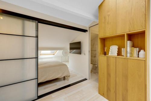 En eller flere senge i et værelse på Le Duplex - à 10 minutes de Paris