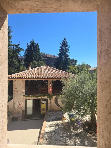 a view of a house with a tile roof at Le Perine 6 in Valdobbiadene