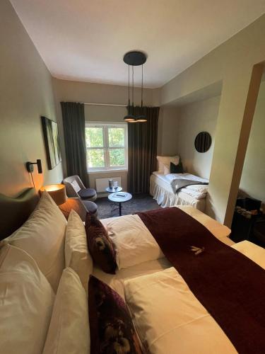 Cama o camas de una habitación en Aksjemøllen - by Classic Norway Hotels