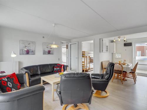 a living room with a couch and chairs and a table at Apartment Mariam - 2-3km from the sea by Interhome in Sønderby
