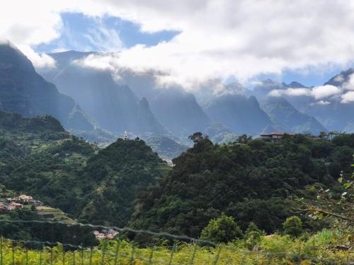 a view of a valley with mountains in the background at CASA GIRASSOL " uma Janela para o Nascer do Sol " in São Vicente