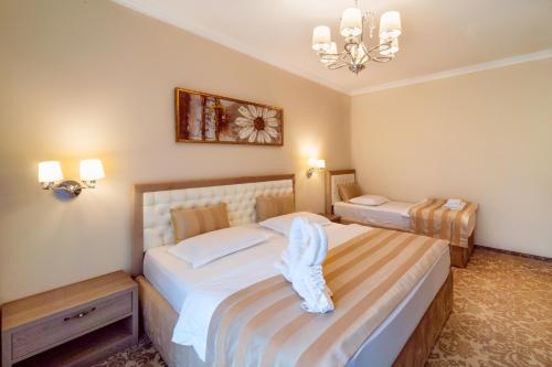 Letto o letti in una camera di J'adore Boutique Hotel