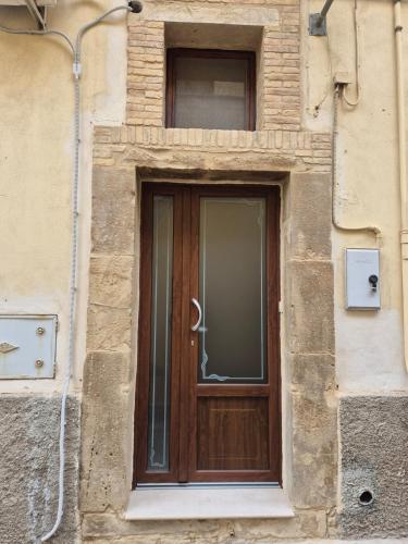 a wooden door on the side of a building at La Piana da Simonetta in Ferrandina