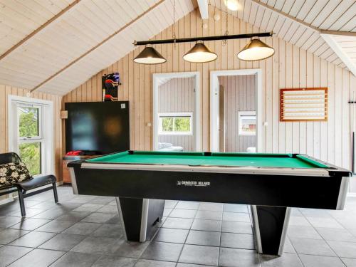 a room with a pool table in a house at Holiday Home Svenny - 800m from the sea by Interhome in Lakolk