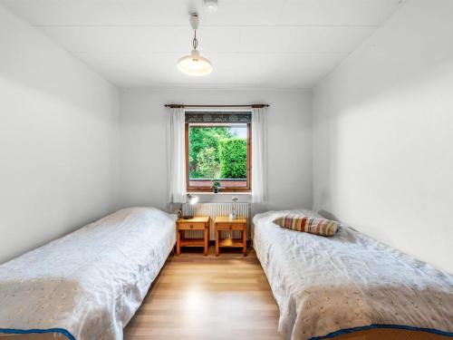 Ένα ή περισσότερα κρεβάτια σε δωμάτιο στο Holiday Home Jalmari - 3-5km from the sea by Interhome