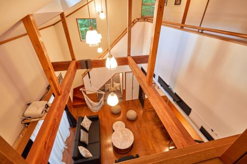 an overhead view of a room with a wooden table at Villa Foresta Sora in Nasushiobara