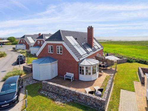 an aerial view of a house with a yard at Holiday Home Langsom - 100m from the sea by Interhome in Havneby
