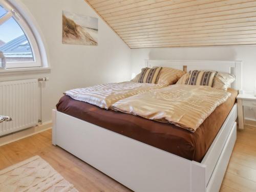 Ένα ή περισσότερα κρεβάτια σε δωμάτιο στο Apartment Aappo - 2-3km from the sea by Interhome