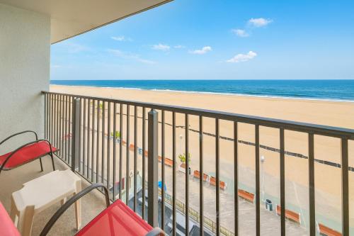 a balcony with a view of the beach at Boardwalk One in Ocean City
