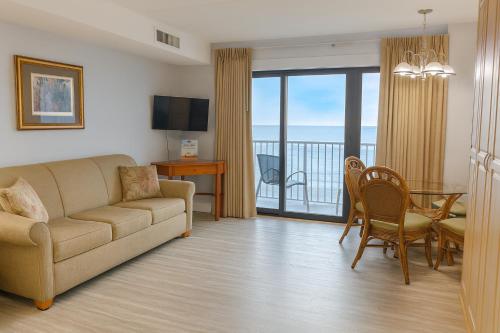 a living room with a couch and a table at Boardwalk One in Ocean City