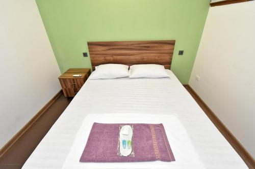 Postel nebo postele na pokoji v ubytování Guset House City