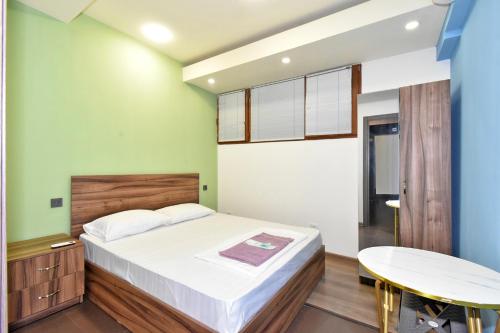 Postel nebo postele na pokoji v ubytování Guset House City