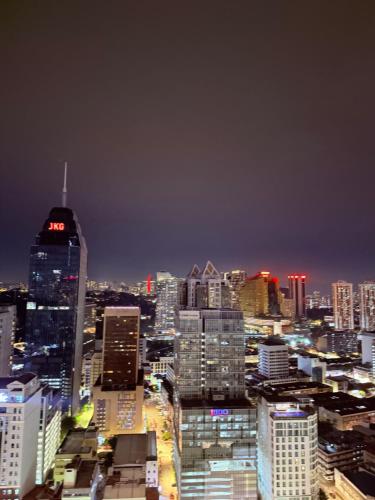 a city skyline at night with a lot of buildings at Majestic Residence Klcc in Kuala Lumpur