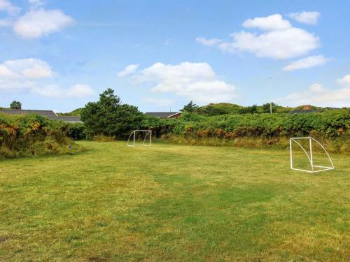 two soccer goals in a grassy field at Holiday Home Dragan - 350m from the sea by Interhome in Vejers Strand