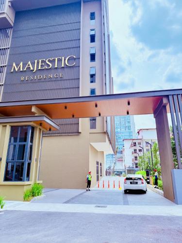 a car is parked in front of a building at Majestic Residence Klcc in Kuala Lumpur