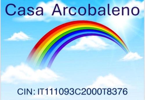 a rainbow in the sky with the words casa accord at Casa Arcobaleno in Ussana