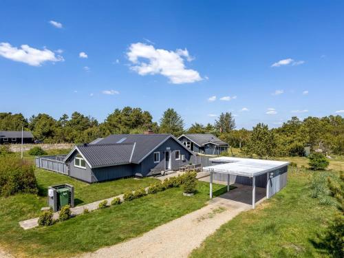 an aerial view of a home with a house at Holiday Home Solvejk - 800m from the sea by Interhome in Vejers Strand