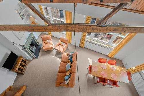 an overhead view of a living room with furniture at Luxury Spacious 3 Bedroom, 3 Bathroom Apartment, Walk to Soho, West End, Covent Garden, China Town, Piccadilly in Minutes, Complimentary Fast WiFi, Tea & Coffee in London