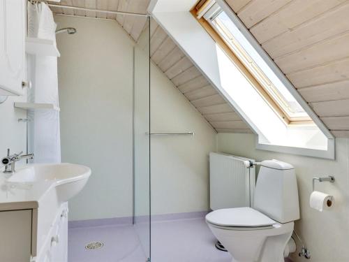 a bathroom with a toilet and a sink at Holiday Home Stefan - 500m from the sea by Interhome in Blåvand