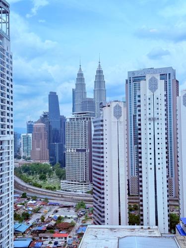 a view of a city skyline with tall buildings at Majestic Residence Klcc in Kuala Lumpur