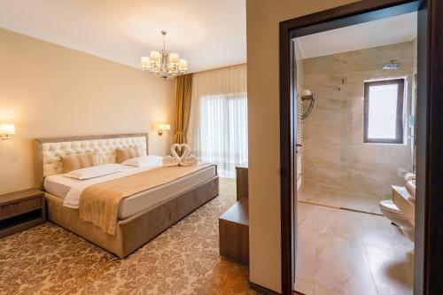 Letto o letti in una camera di J'adore Boutique Hotel