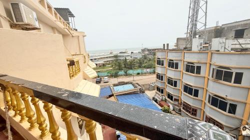 a view from the balcony of a building at SEA VIEW & SWIMMING POOL HOTEL SGHR ! PURi Air-Conditioned Rooms with Balconies, Restaurant, LIFT & Free Wi-Fi - Best Hotel In Puri in Puri