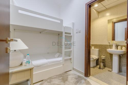 a small bathroom with a toilet and a sink at Villa with Private Pool, Near Reef Oasis Diving Center And Just Minutes from Address Beach Resort, Al Dana Island, Fujairah in Fujairah