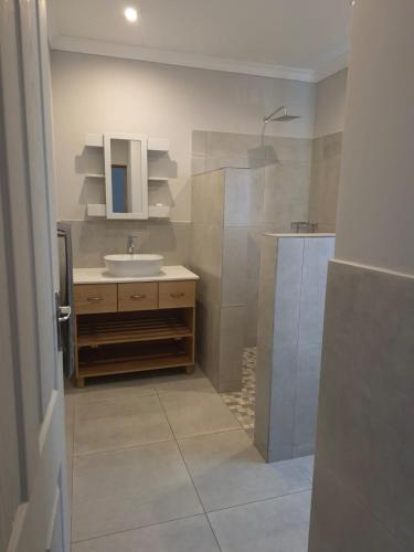 a bathroom with a sink and a shower at 870 on Riverview Drive in Mtubatuba