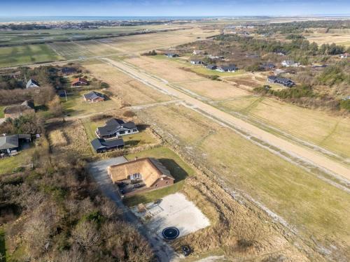 an aerial view of a house in a field at Holiday Home Lemmikki - 1-5km from the sea by Interhome in Ringkøbing