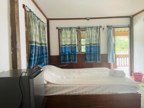 Katil atau katil-katil dalam bilik di Sipasert Guesthouse-Tadlo