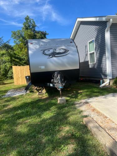 a house with a painting on the back of it at Sleepyheadz Campers and Tents LLC in Bloomington