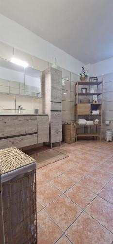 a large room with a counter and some drawers at Villa Penelope Luxury Retreat with Pool & Timeless Charm in Douliana