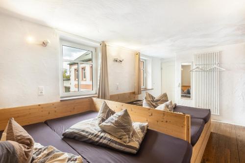 a room with two beds and a window at Ferienhaus Rodershausen in Rodershausen