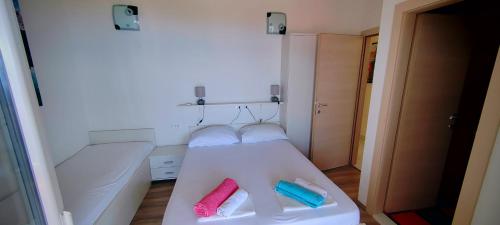 a hospital bed with two pillows on it in a room at Apartmani ANDRIJA in Živogošće