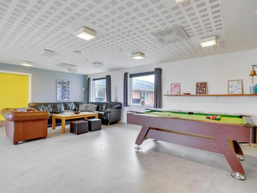 a living room with a pool table in it at Holiday Home Martinus - 5-5km from the sea by Interhome in Tim