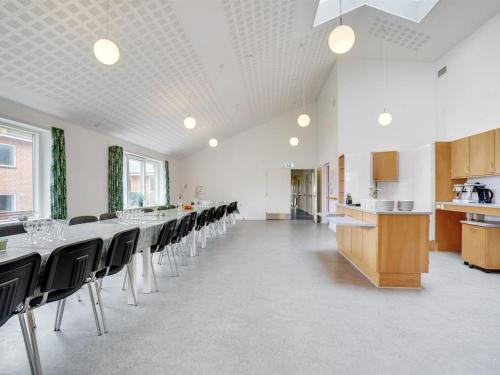 a large room with a long table and chairs at Holiday Home Martinus - 5-5km from the sea by Interhome in Tim