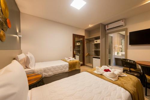 Una cama o camas en una habitación de Uri Pousada