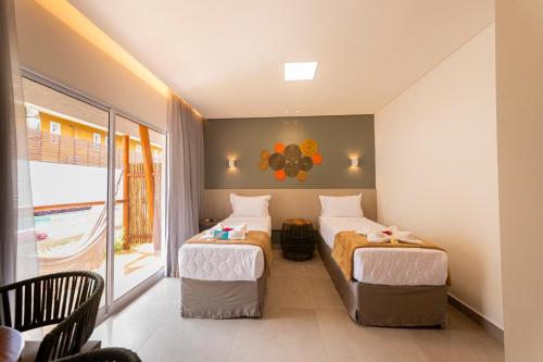 Una cama o camas en una habitación de Uri Pousada