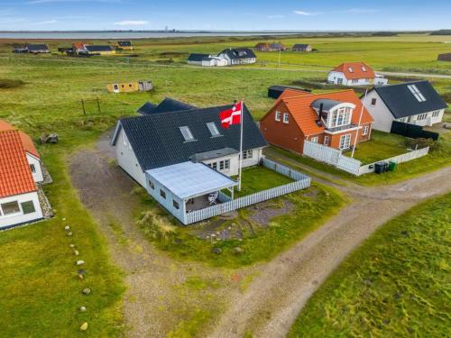 an aerial view of a house with a canadian flag at Holiday Home Orvo - 150m from the sea by Interhome in Harboør